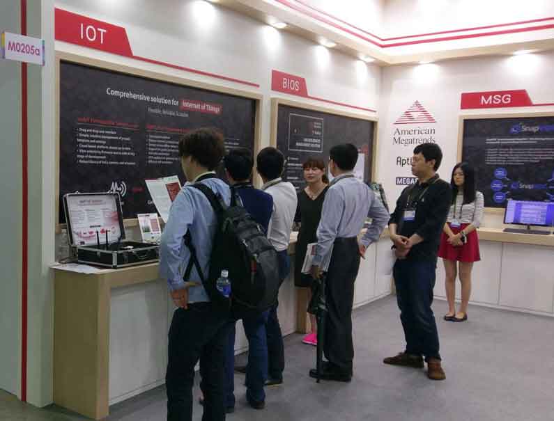 Group of people interacting with AMI booth