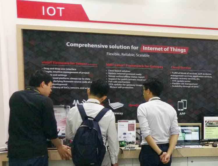 Group of people interacting with AMI booth